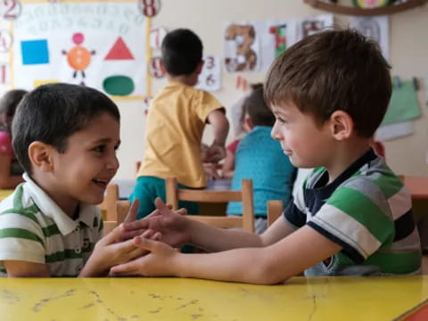 a few young boys in a classroom