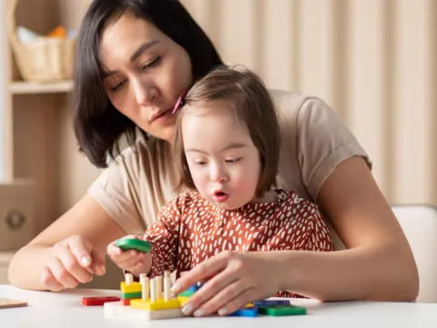 a woman and a child playing with toys