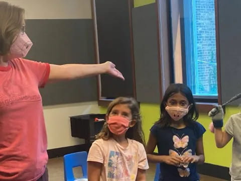 a group of children with face paint