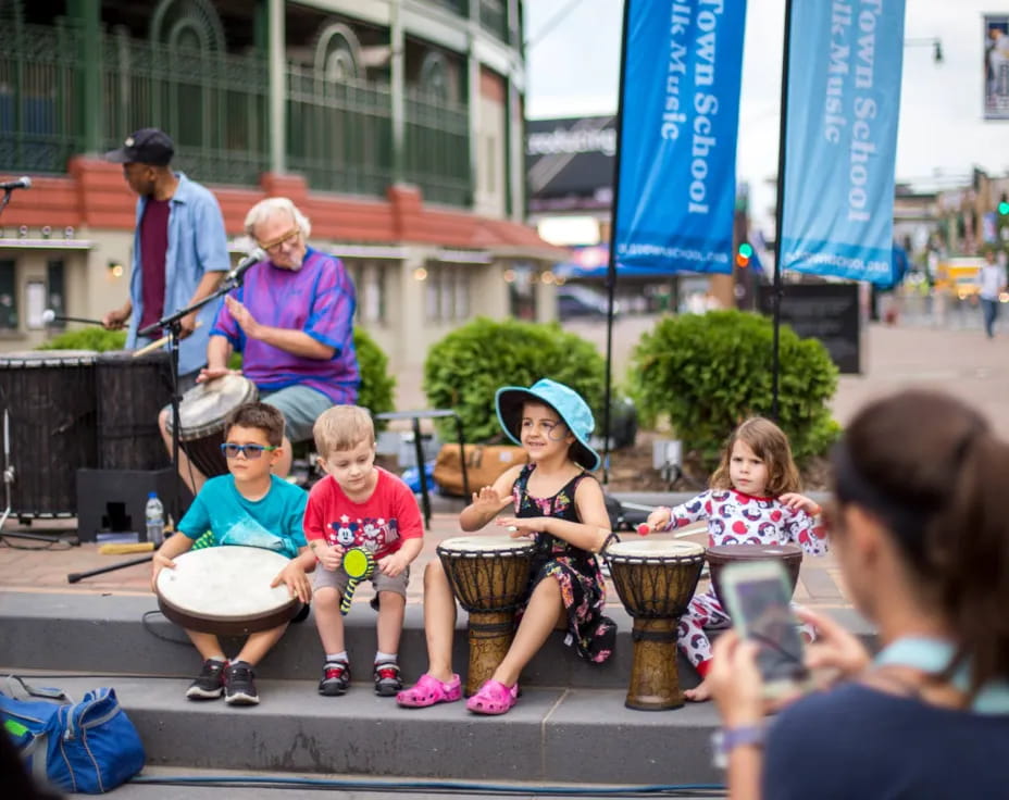 a group of people playing drums