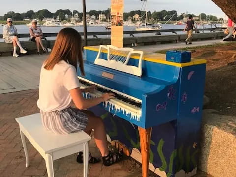 a woman painting outside