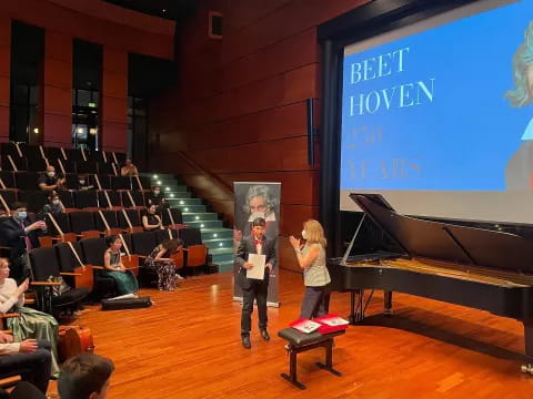 a man and woman on stage