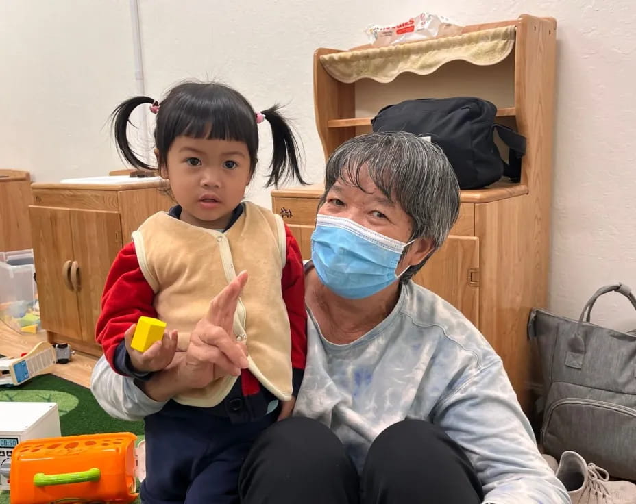 a person holding a child