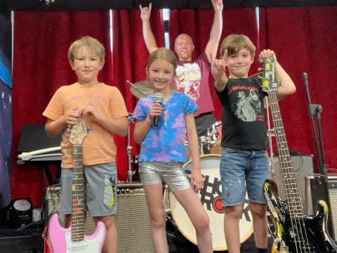 a group of kids holding musical instruments