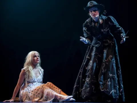 a man and woman on stage