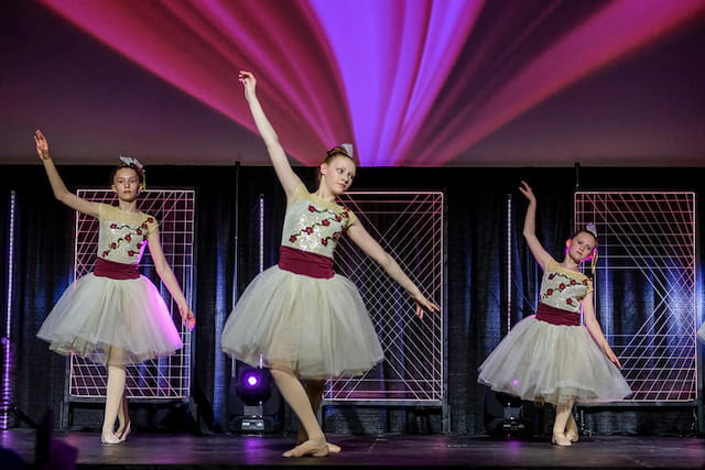 a group of women dancing on a stage