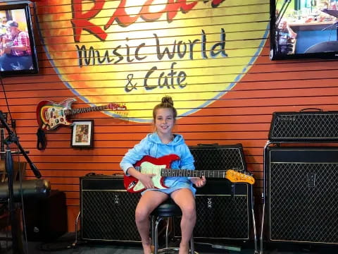 a girl sitting on a bench