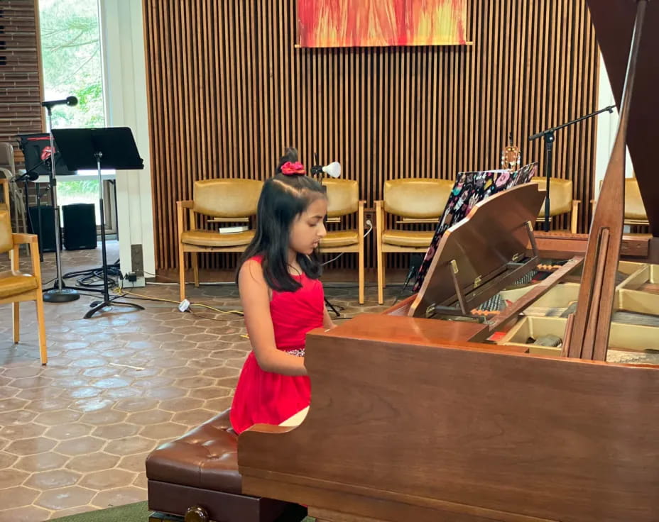 a girl playing the piano