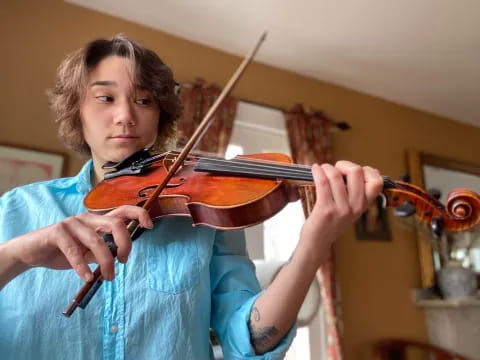 a person playing a violin