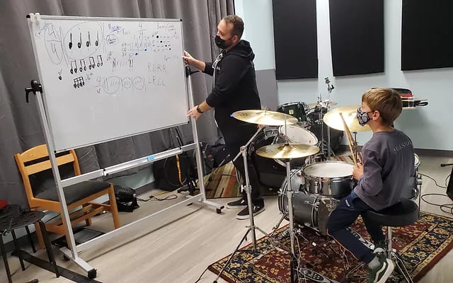 a man and a woman playing instruments