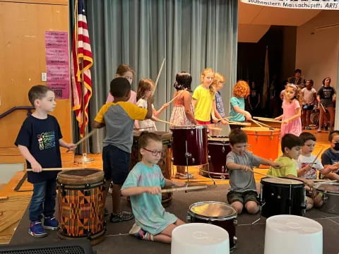children playing drums in a room