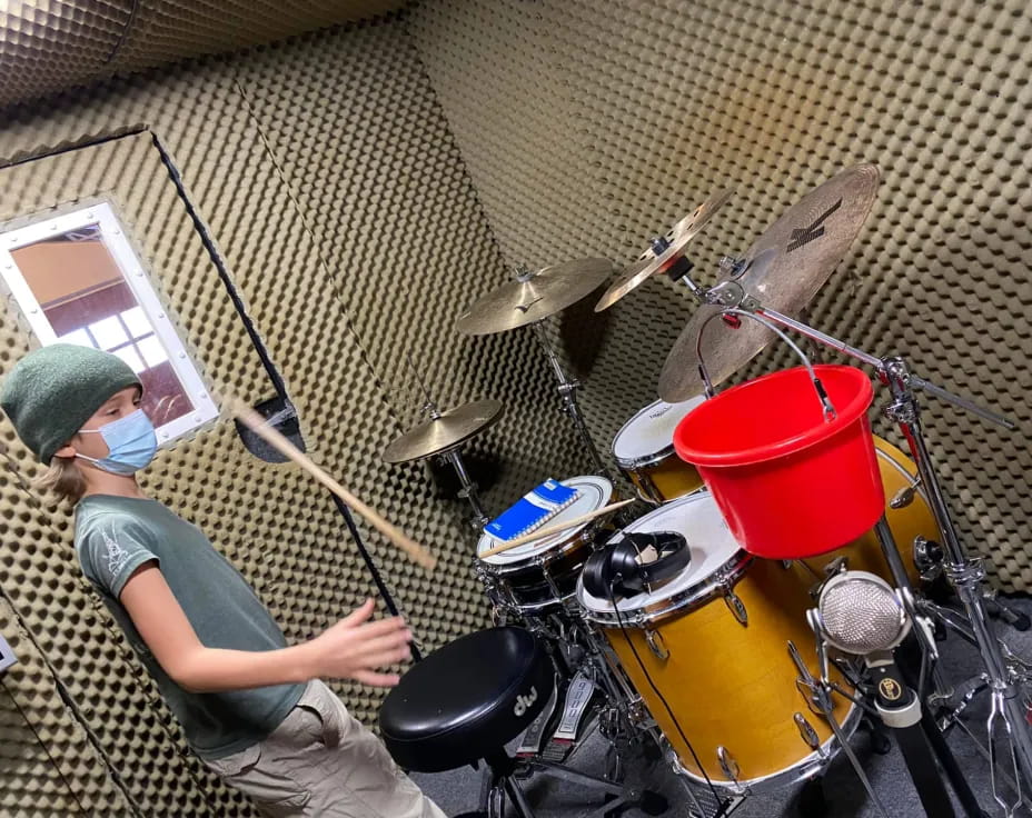 a person playing a drum set