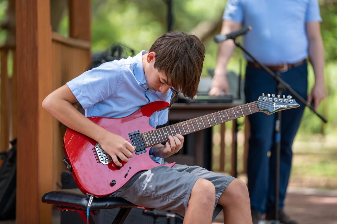 a man playing a guitar