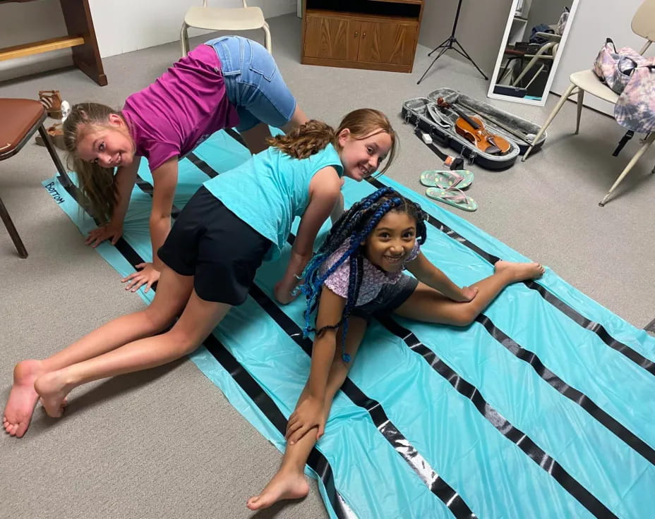 a group of women doing yoga