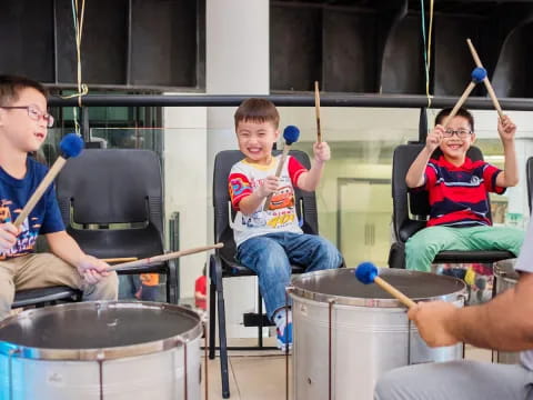 a group of people playing drums
