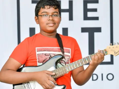 a person playing a guitar