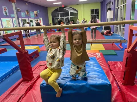 a couple of children on a slide