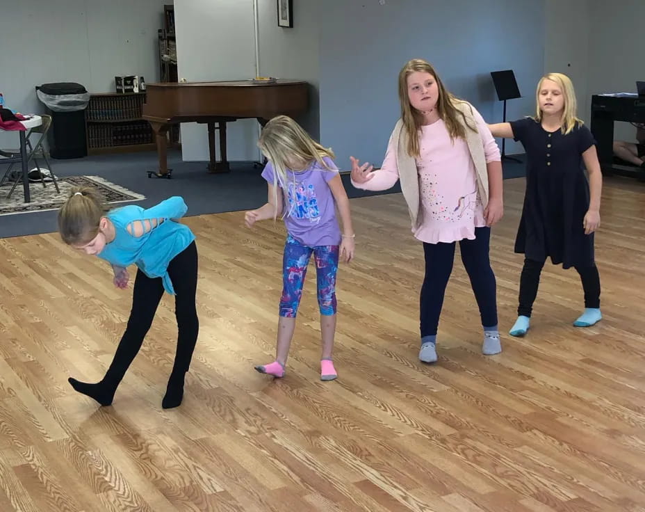 a group of children dancing