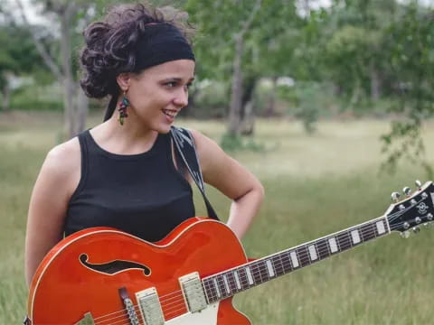 a person playing a guitar