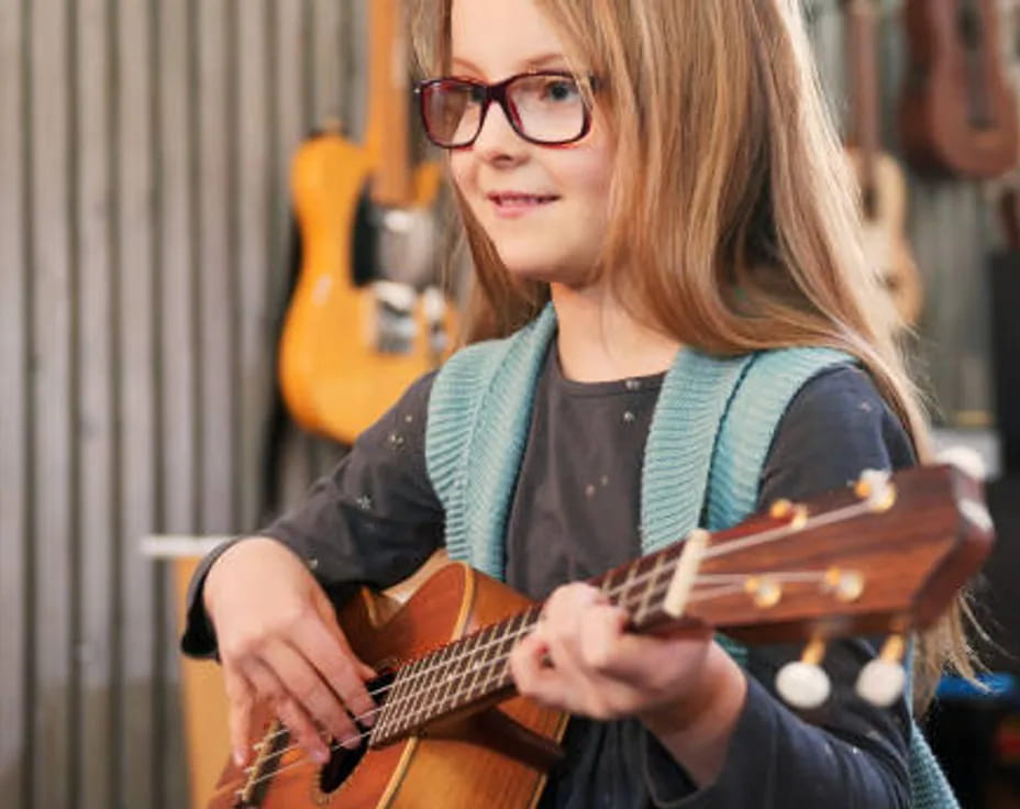 a woman playing a guitar