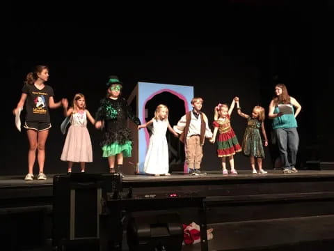 a group of children on a stage