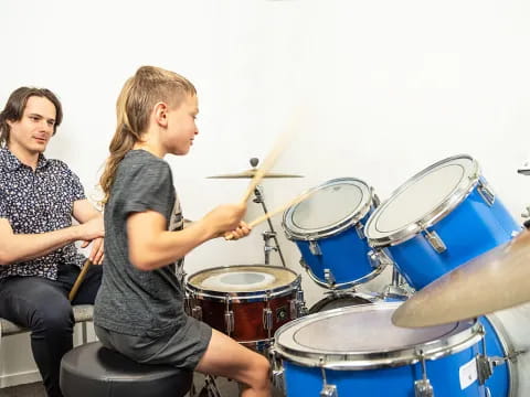 a woman playing drums