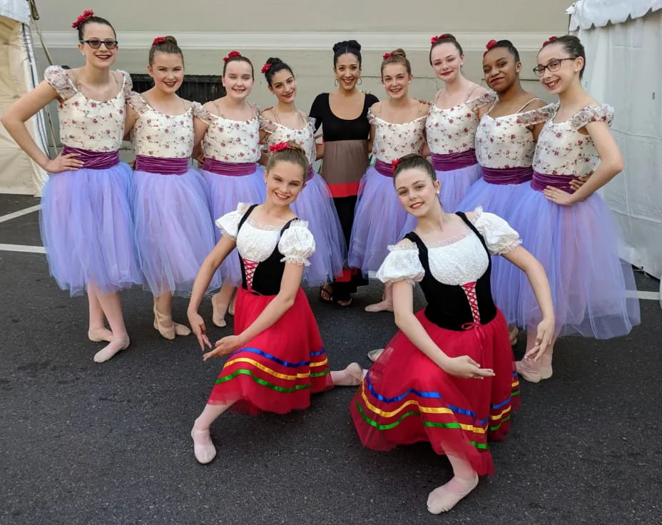a group of women in dresses