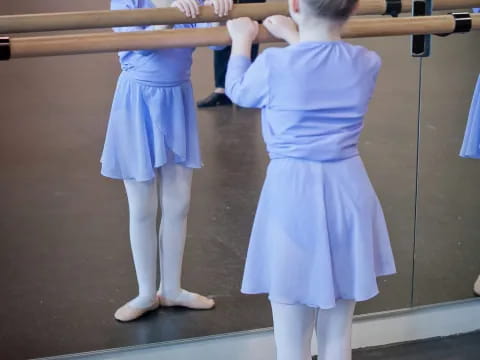 a couple of girls in blue dresses
