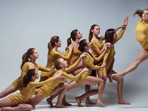 a group of women in yellow uniforms