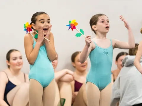a group of women in blue dresses