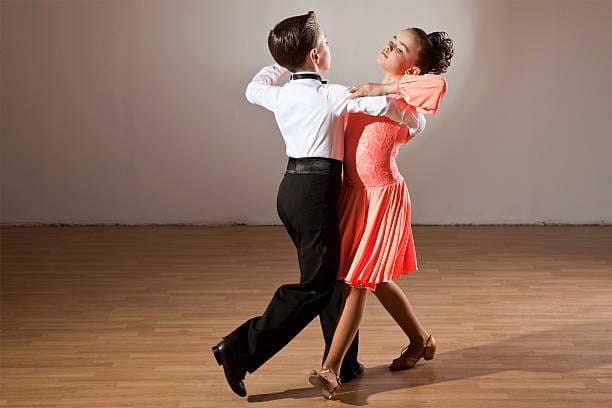 a man and woman dancing