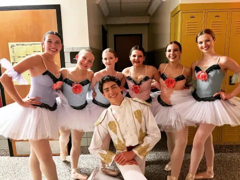 a group of women in white dresses