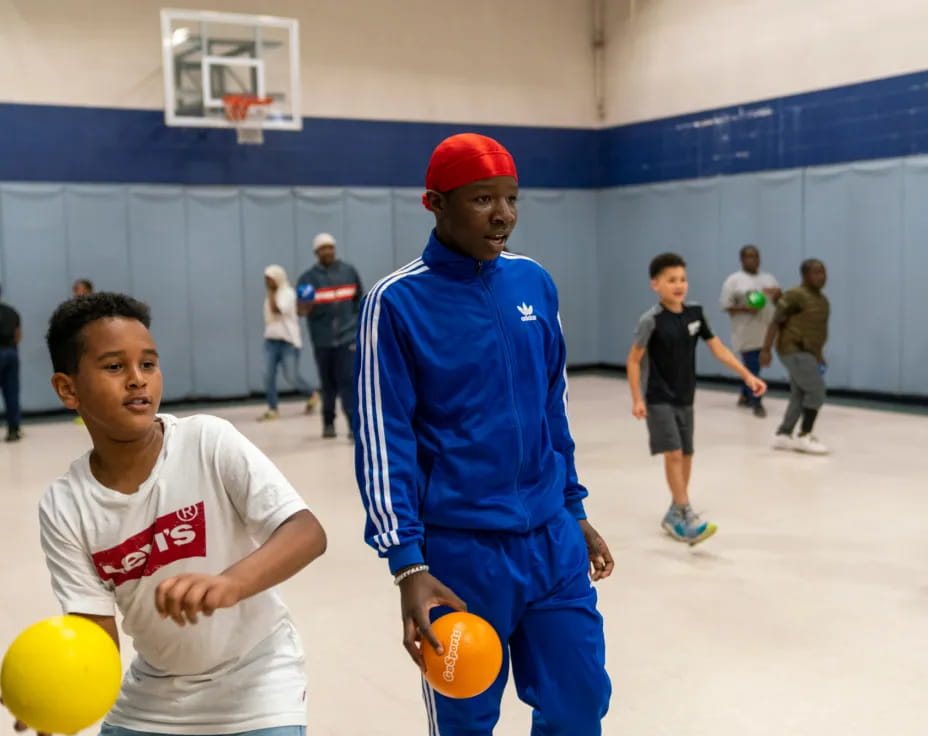 a man holding a ball