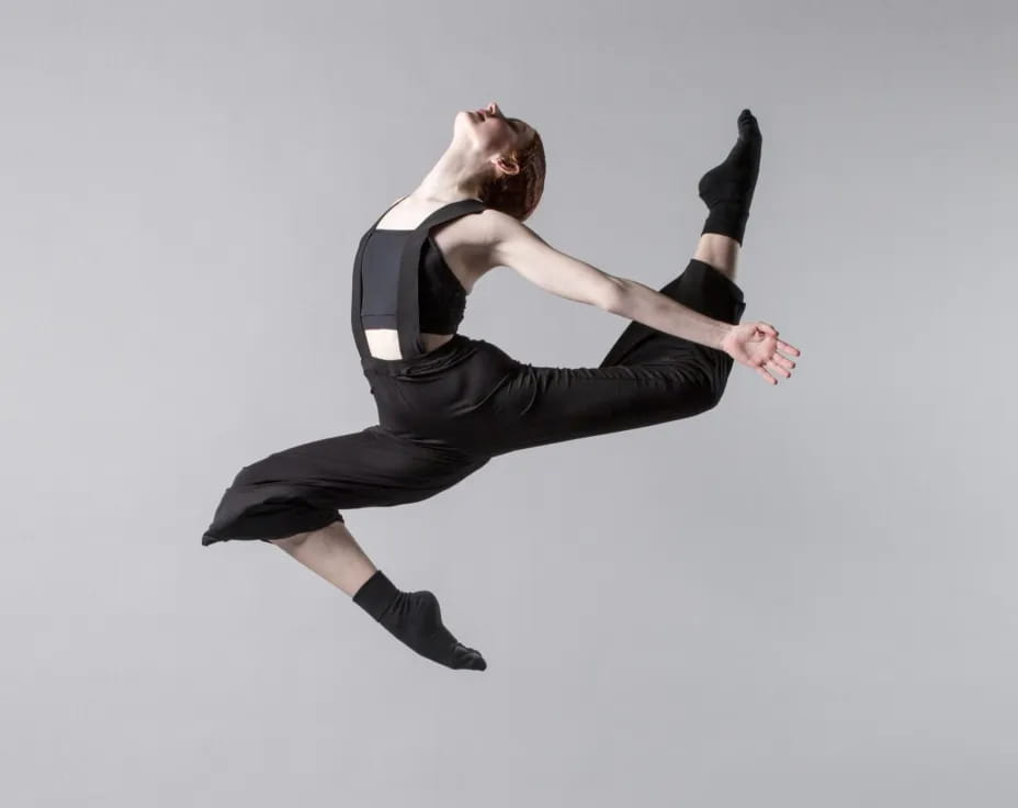 a person in a black outfit