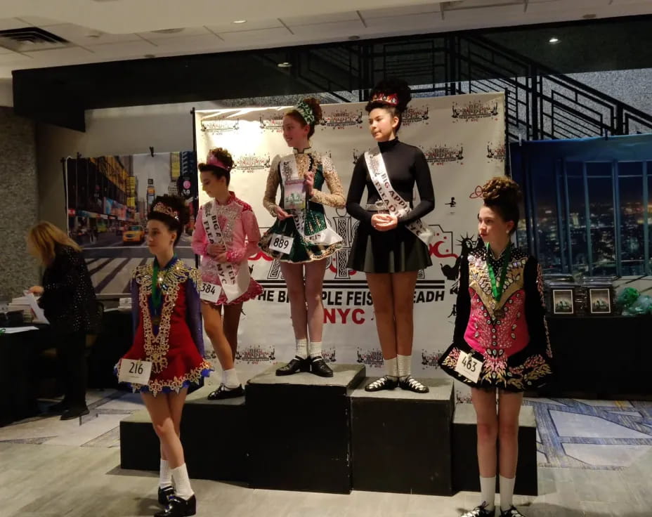 a group of women in dresses