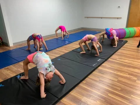 a group of children doing yoga