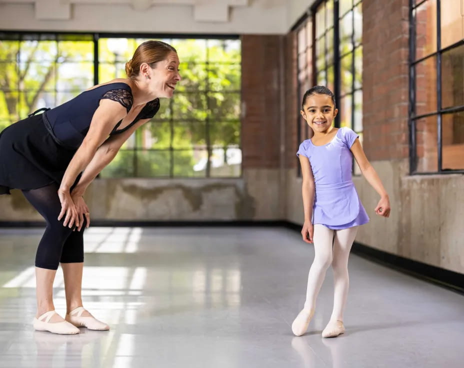 a person and a girl dancing