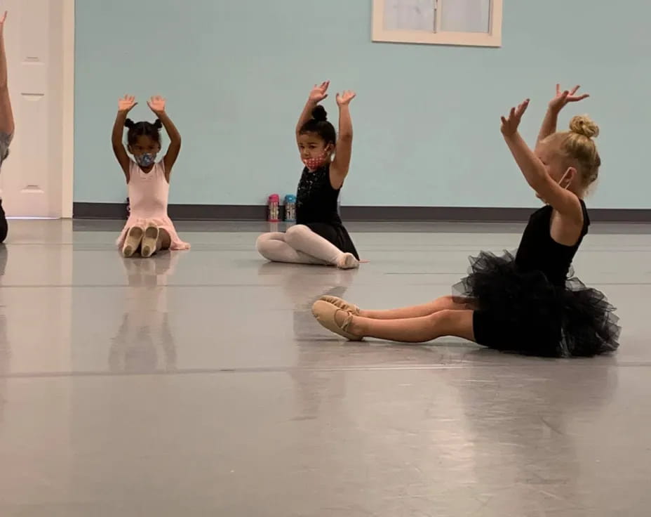 a group of women doing yoga