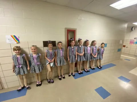 a group of children wearing roller blades