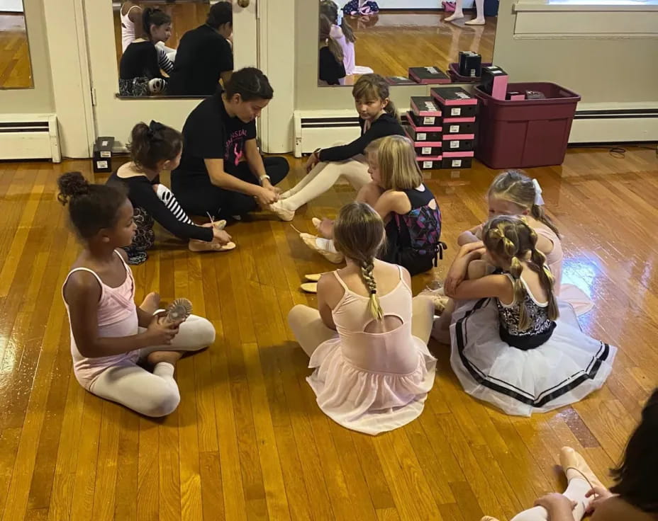 a group of people sitting on the floor