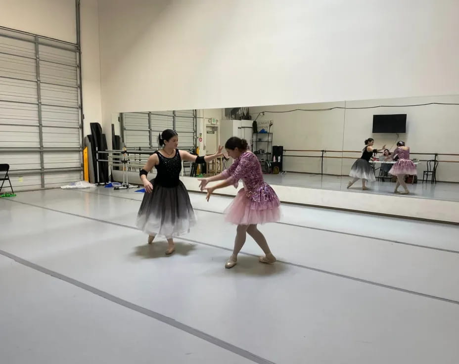 a couple of girls dancing