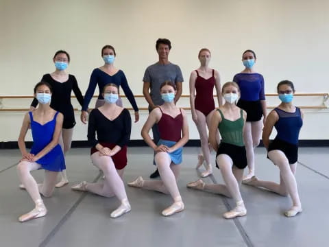 a group of people wearing masks