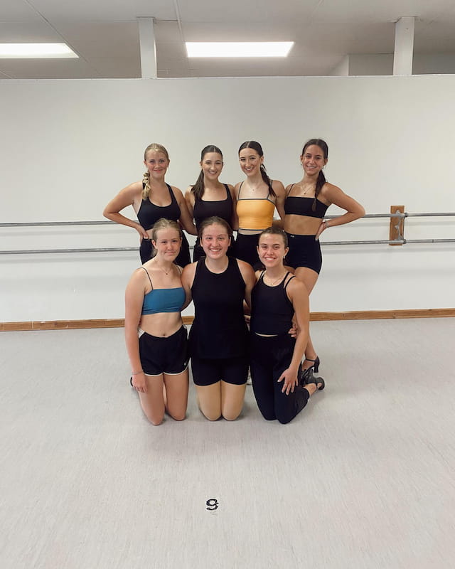 a group of women posing for a photo