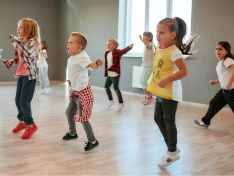 a group of children dancing