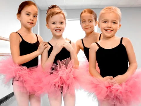 a group of girls in dresses