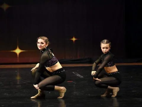 two women on a stage