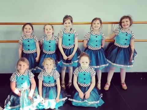 a group of women in dresses