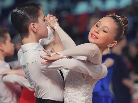 a man and woman dancing