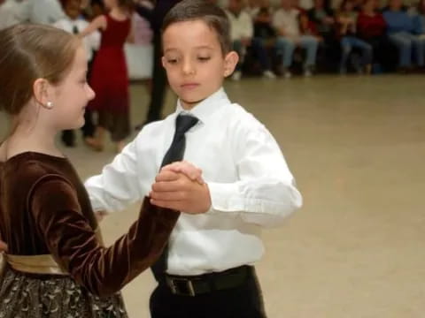 a person and a child dancing