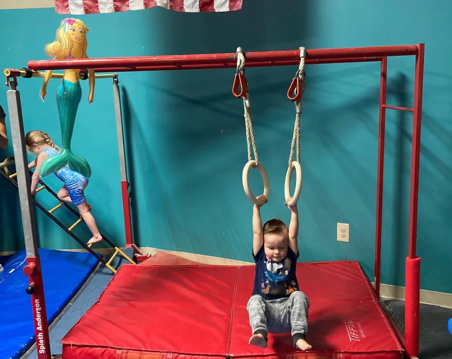 a boy on a swing set